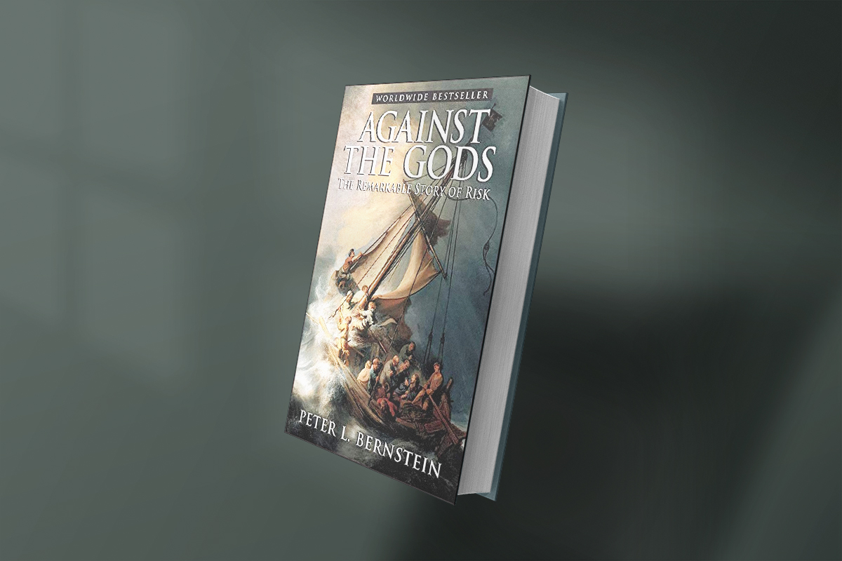 A photo of the book Against the Gods: The Remarkable Story of Risk by Peter L. Bernstein, featuring a dramatic painting of a stormy sea with sailors on a boat.