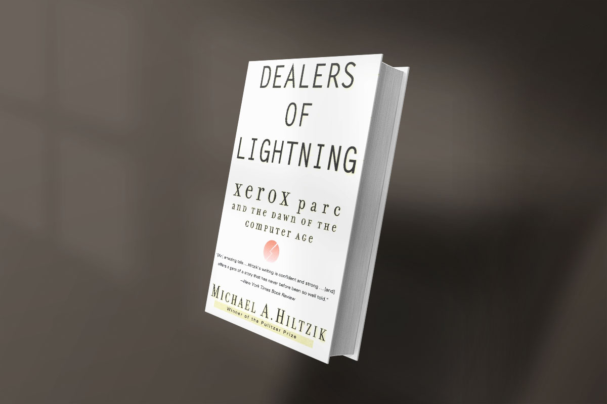 Book cover of Dealers of Lightning: Xerox PARC and the Dawn of the Computer Age by Michael A. Hiltzik, featuring minimalist white background with bold black and gold text, and a small red circle in the center.