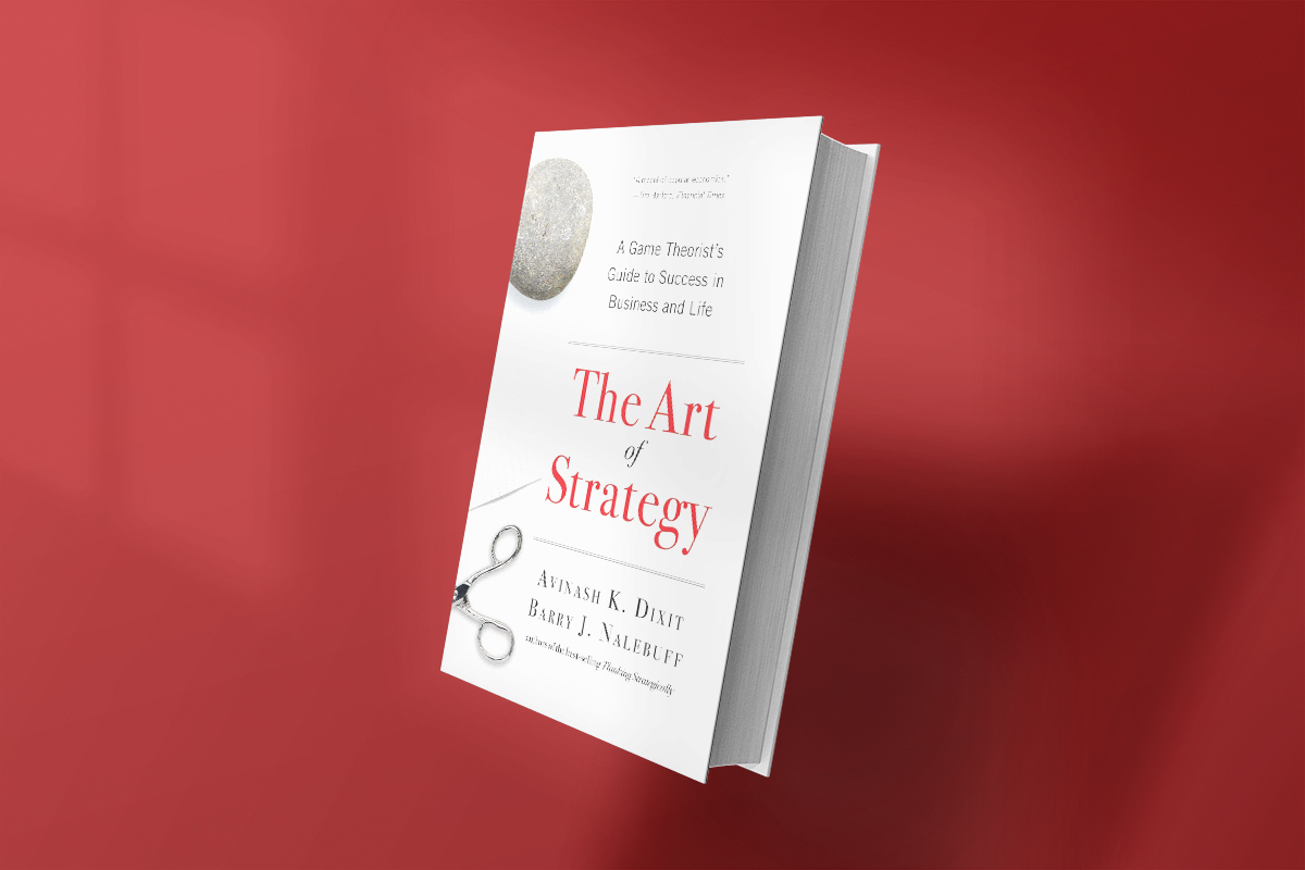 The book The Art of Strategy by Avinash K. Dixit and Barry J. Nalebuff, featuring a minimalist white cover with a rock and scissors illustration, offers insights on game theory applied to business and life decision-making.