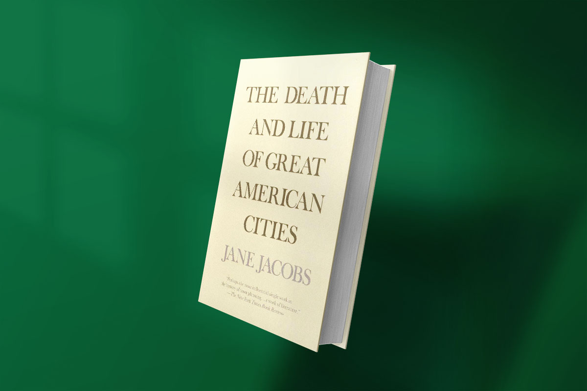 Cover of The Death and Life of Great American Cities by Jane Jacobs, featuring minimalist beige background with bold serif text.