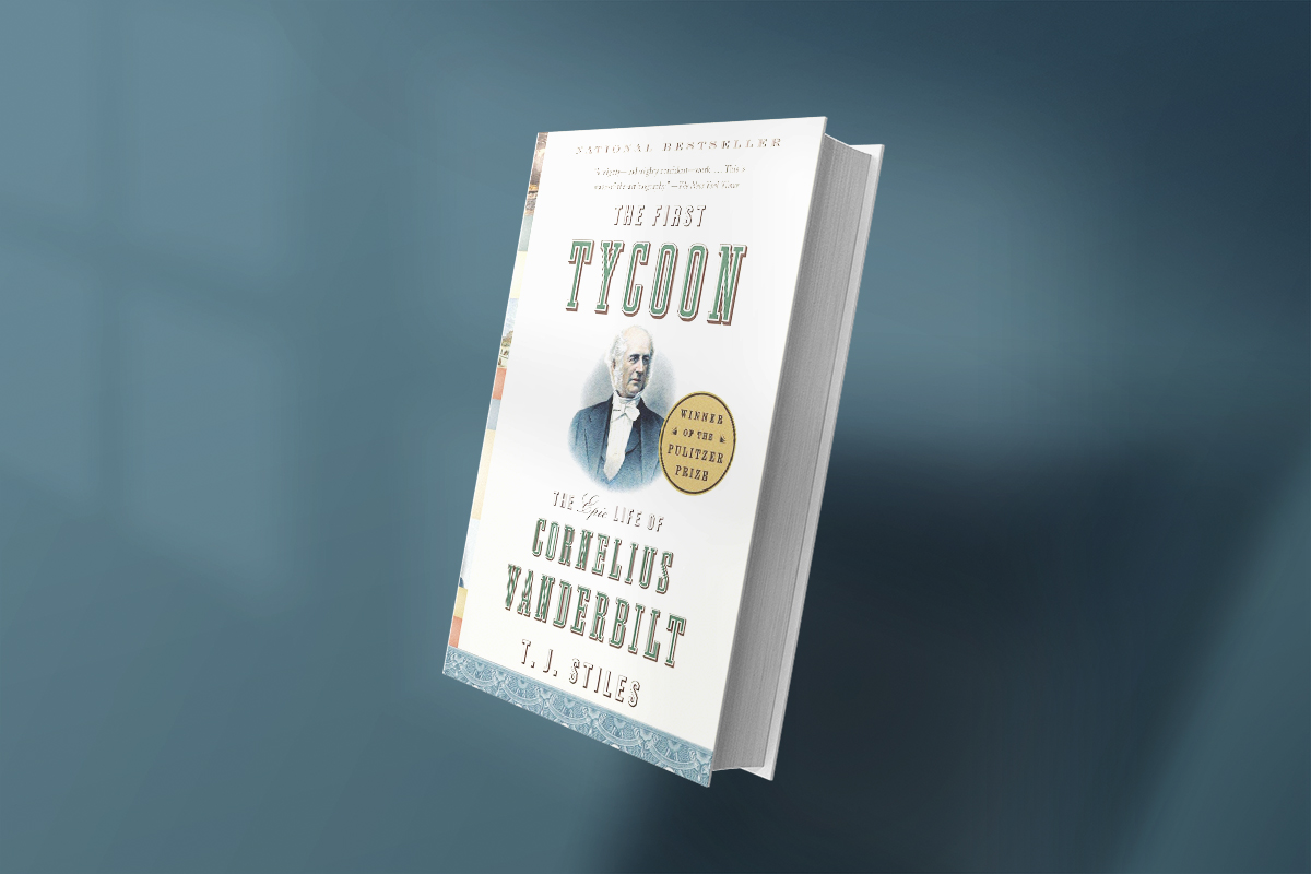 Cover of The First Tycoon by T.J. Stiles, showing a portrait of Cornelius Vanderbilt with a gold Pulitzer Prize badge and decorative blue border, set against a clean white background.